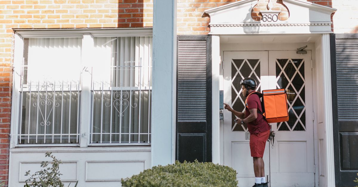 locksmith unlocking front door — Neon Key Locksmith
